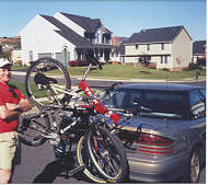 Ed helps load up the bike.  Click to Enlarge  picture.